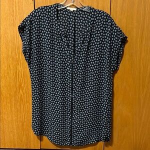 Pleione cap sleeve top. V-neck with zipper down front. Cut outs at neck line.